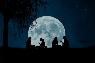 sitting under a full moon